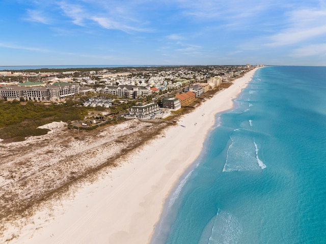 drone / aerial view with a beach view and a water view