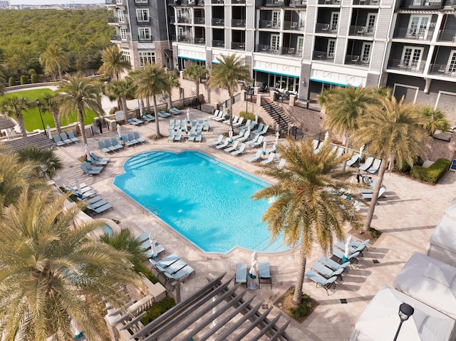 view of swimming pool featuring a patio area