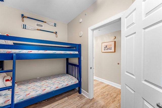 bedroom with hardwood / wood-style flooring