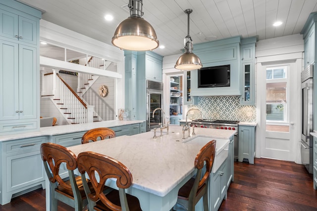 kitchen with tasteful backsplash, wooden ceiling, dark wood finished floors, and pendant lighting