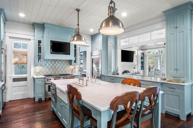 kitchen with dark wood-type flooring, wooden ceiling, backsplash, and high quality appliances