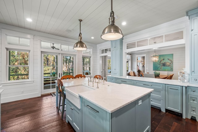 kitchen with dark wood-style floors, wood ceiling, french doors, and a sink