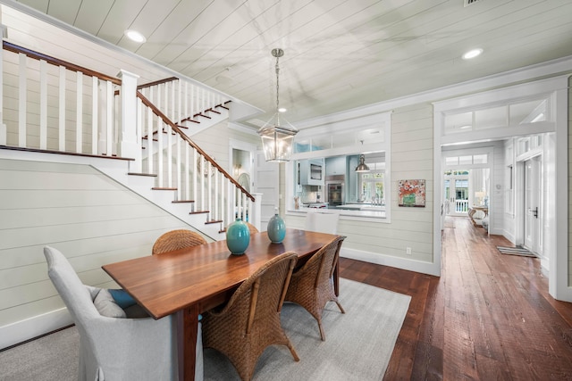 dining space with baseboards, dark wood finished floors, ornamental molding, stairs, and recessed lighting