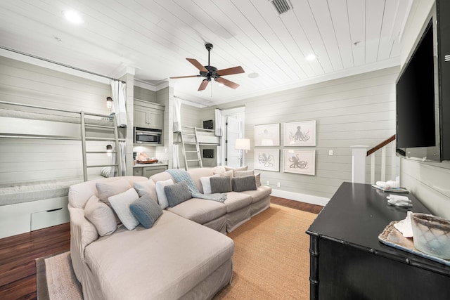 living room featuring crown molding, visible vents, a ceiling fan, light wood-type flooring, and wooden ceiling