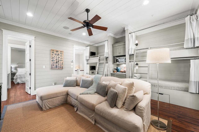 living area with recessed lighting, wood finished floors, wood ceiling, a ceiling fan, and ornamental molding