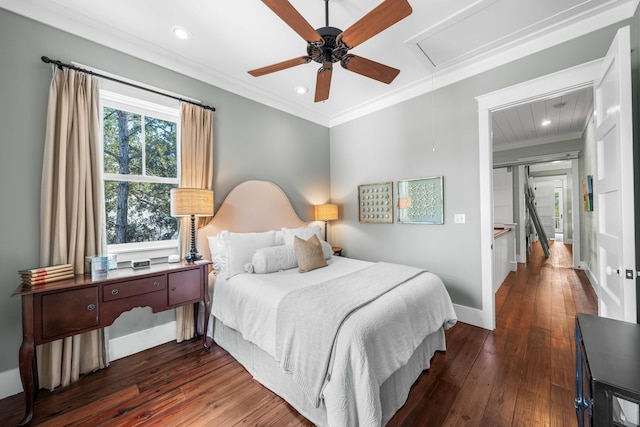 bedroom featuring recessed lighting, hardwood / wood-style floors, attic access, ornamental molding, and baseboards