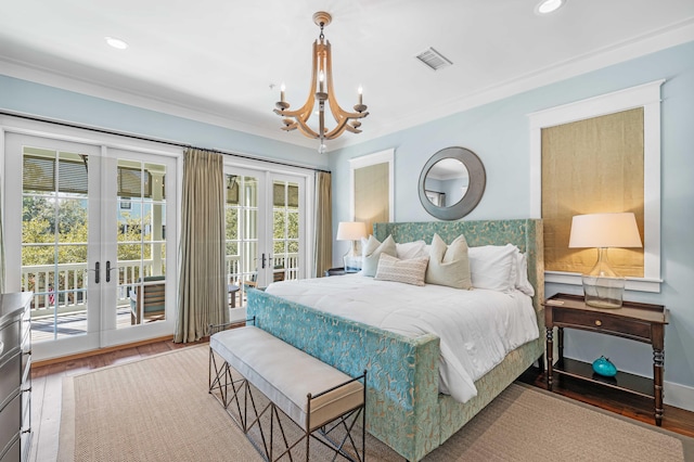 bedroom with visible vents, wood finished floors, access to outside, french doors, and recessed lighting