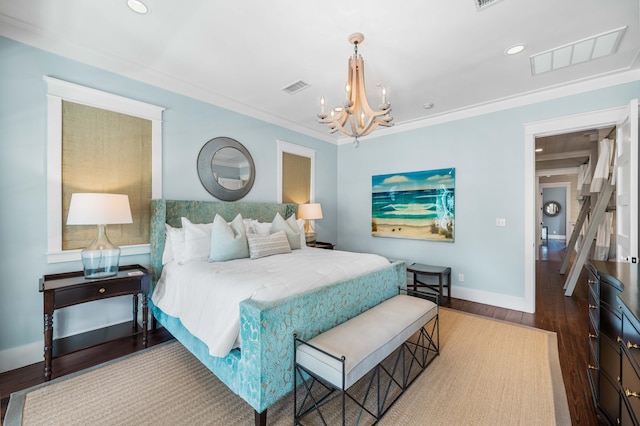 bedroom featuring ornamental molding, visible vents, baseboards, and wood finished floors