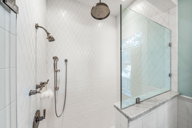 bathroom with a tile shower