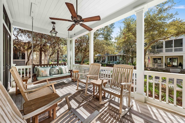 deck featuring a ceiling fan and an outdoor living space