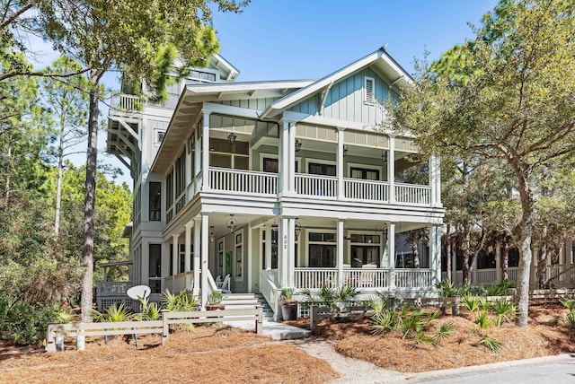 view of front facade featuring board and batten siding, a porch, and a balcony