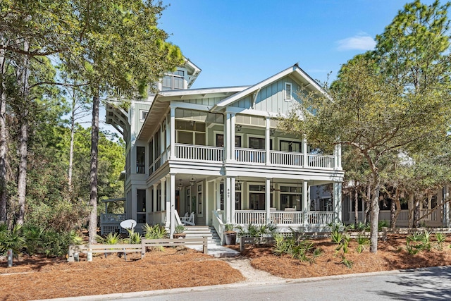 view of front of home featuring a balcony, covered porch, and board and batten siding