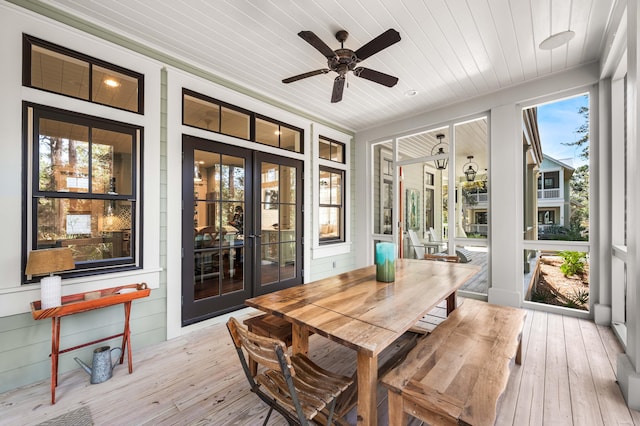 sunroom / solarium with wood ceiling, ceiling fan, and french doors