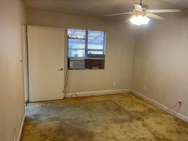 unfurnished room with carpet, cooling unit, a textured ceiling, and ceiling fan