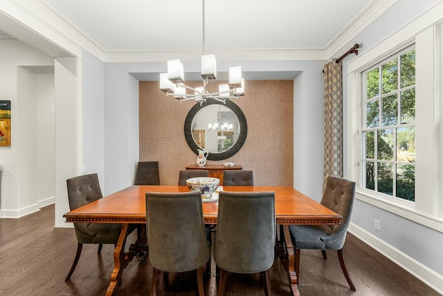 dining room featuring an inviting chandelier, wood finished floors, baseboards, and ornamental molding