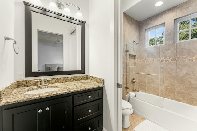 bathroom featuring vanity, tile patterned floors, toilet, and tub / shower combination