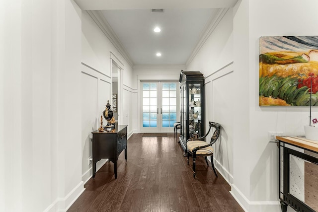 hall featuring dark wood finished floors, recessed lighting, french doors, crown molding, and baseboards