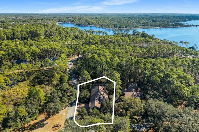 bird's eye view featuring a view of trees and a water view