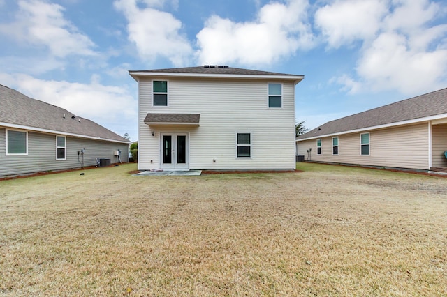 back of house with french doors, a yard, a patio area, and cooling unit