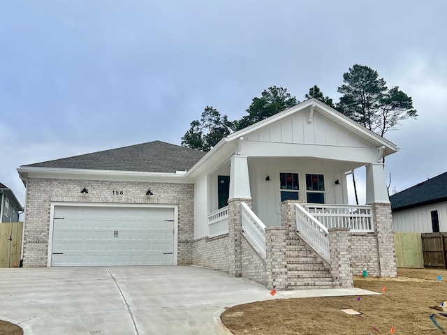 view of front of property with a garage and a porch