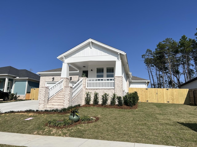 view of front of house featuring a front yard and a porch