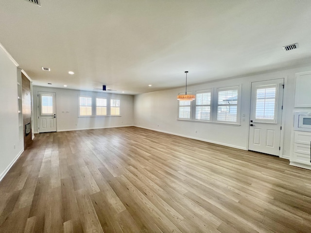 unfurnished living room featuring light hardwood / wood-style floors