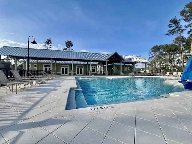 view of swimming pool featuring a patio area