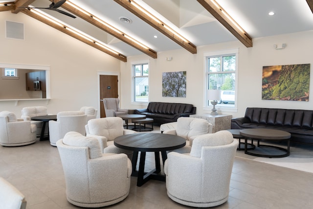 interior space with high vaulted ceiling and beam ceiling