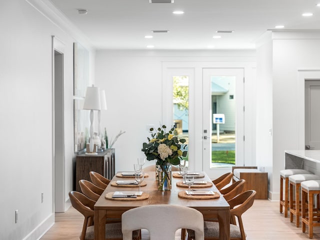 dining space with light hardwood / wood-style flooring