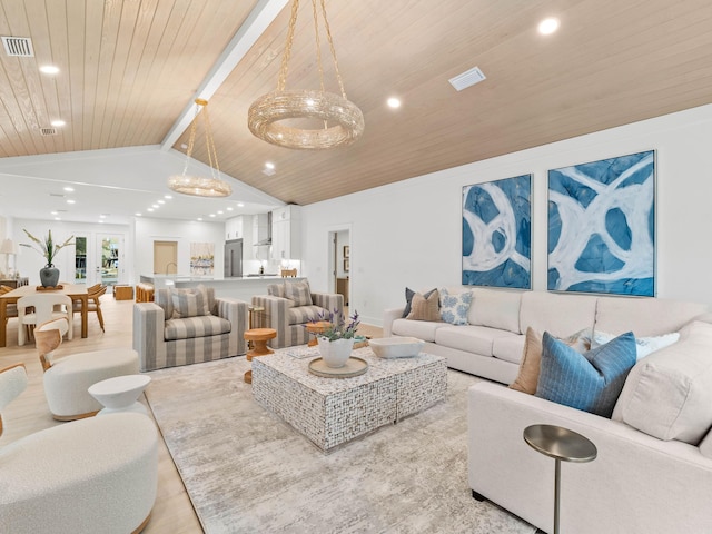 living room featuring lofted ceiling, light hardwood / wood-style floors, and wood ceiling