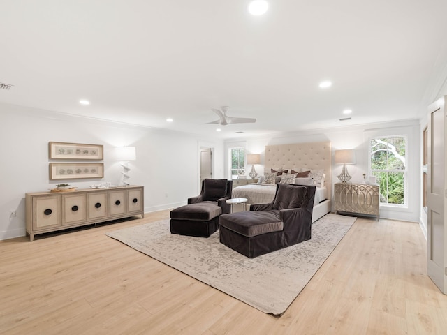 living room with light wood-type flooring and ceiling fan