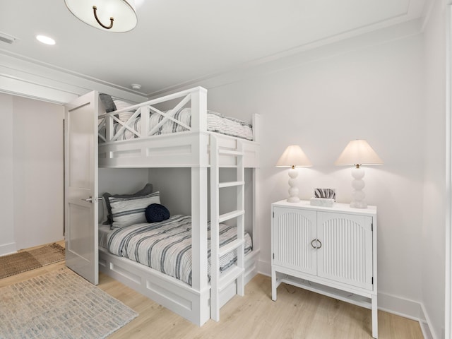 bedroom with hardwood / wood-style flooring