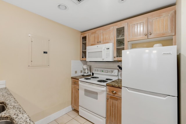 kitchen with tasteful backsplash, light tile patterned floors, electric panel, light stone counters, and white appliances