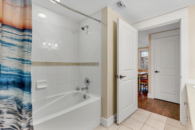 bathroom featuring tile patterned floors, vanity, and shower / bath combination with curtain