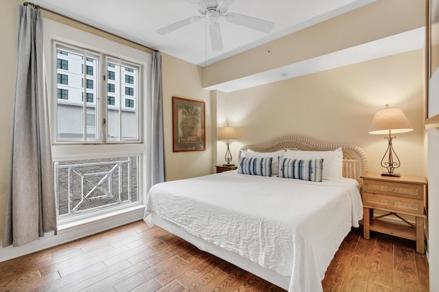 bedroom with ceiling fan and wood-type flooring