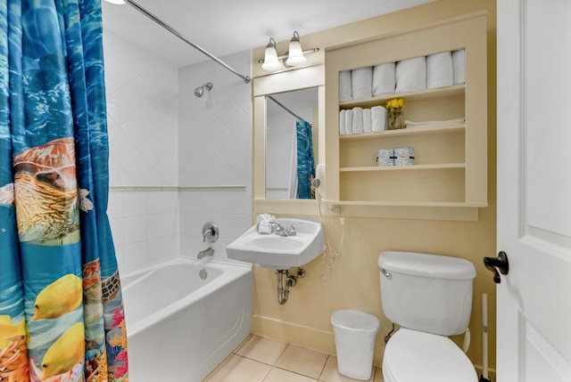 bathroom featuring shower / tub combo with curtain, tile patterned flooring, and toilet