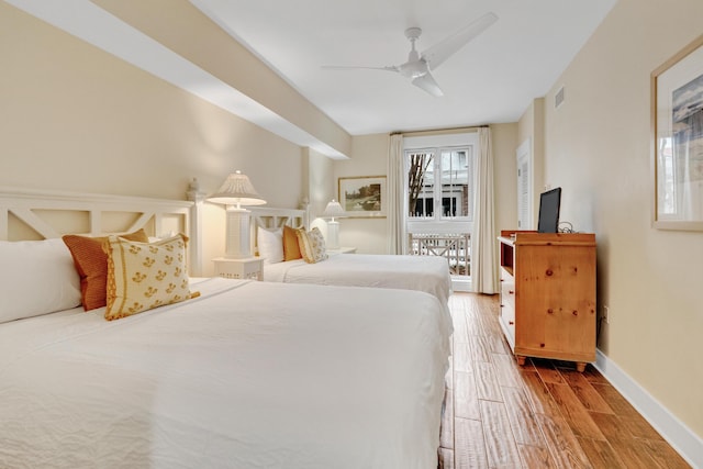 bedroom featuring hardwood / wood-style flooring and ceiling fan