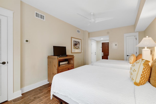 bedroom with hardwood / wood-style flooring and ceiling fan