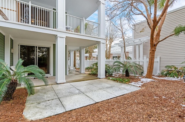 exterior space with a pergola and a balcony