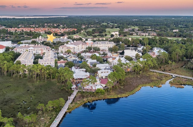 aerial view at dusk with a water view