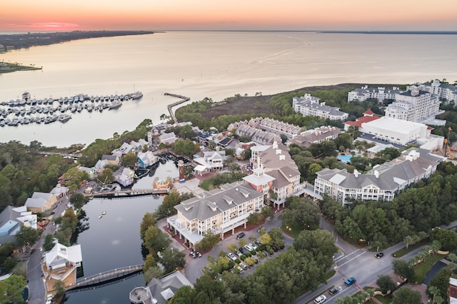 aerial view at dusk with a water view