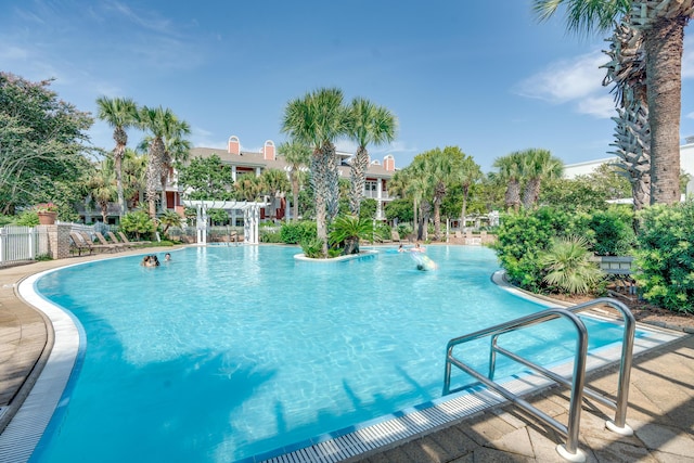 view of swimming pool featuring a pergola