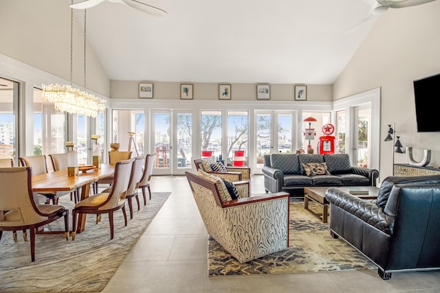 tiled living room featuring french doors, high vaulted ceiling, and a notable chandelier