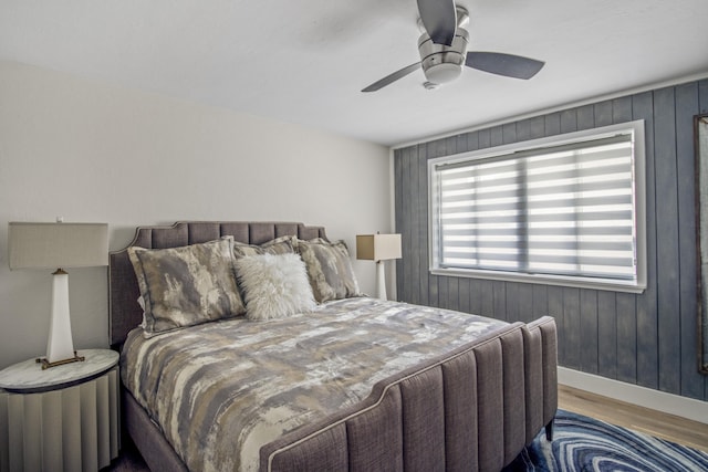 bedroom with ceiling fan and light wood-type flooring