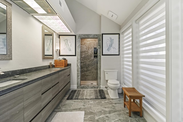 bathroom with lofted ceiling, toilet, a shower with shower door, and vanity