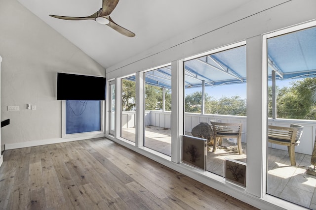 unfurnished sunroom featuring ceiling fan and lofted ceiling