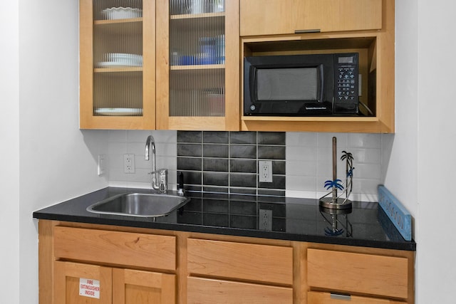 kitchen featuring sink and decorative backsplash