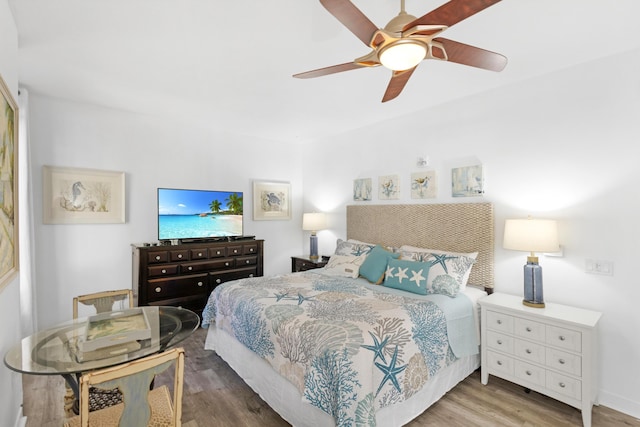 bedroom with hardwood / wood-style flooring and ceiling fan