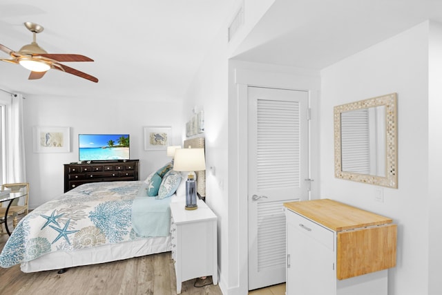 bedroom with ceiling fan and light wood-type flooring