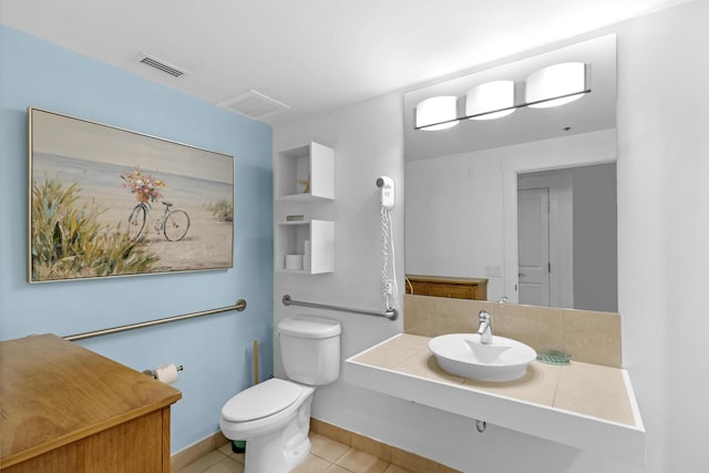 bathroom with sink, tile patterned floors, and toilet